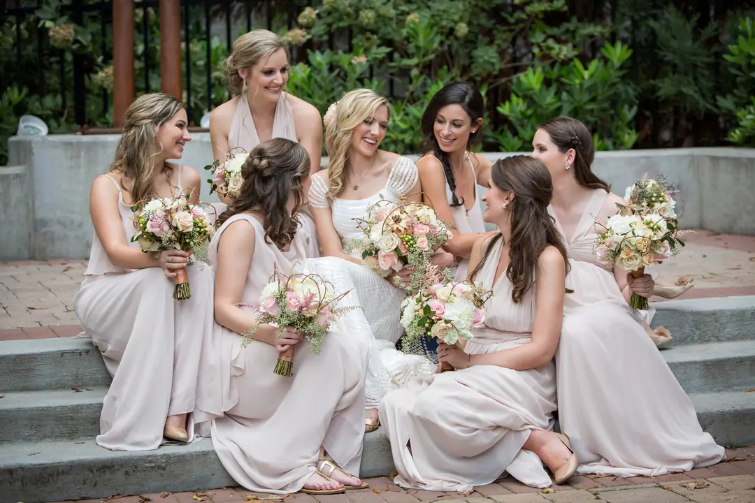 bride girl group pose with flowers